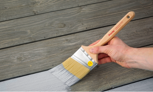 painting a deck with a Purdy brush