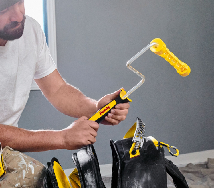 painter with a Purdy roller frame