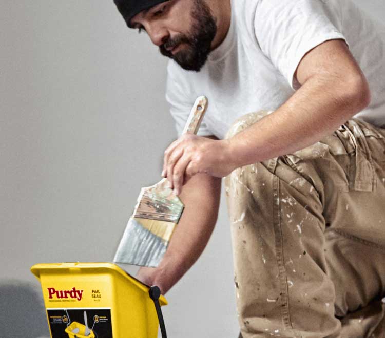 painter using Purdy Pail and brush