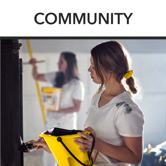 Women painting using Purdy brushes and buckets